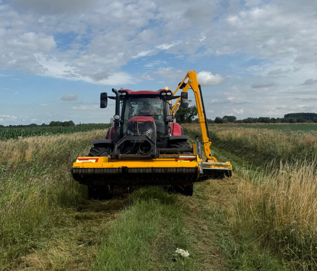 tractor clearing on field
