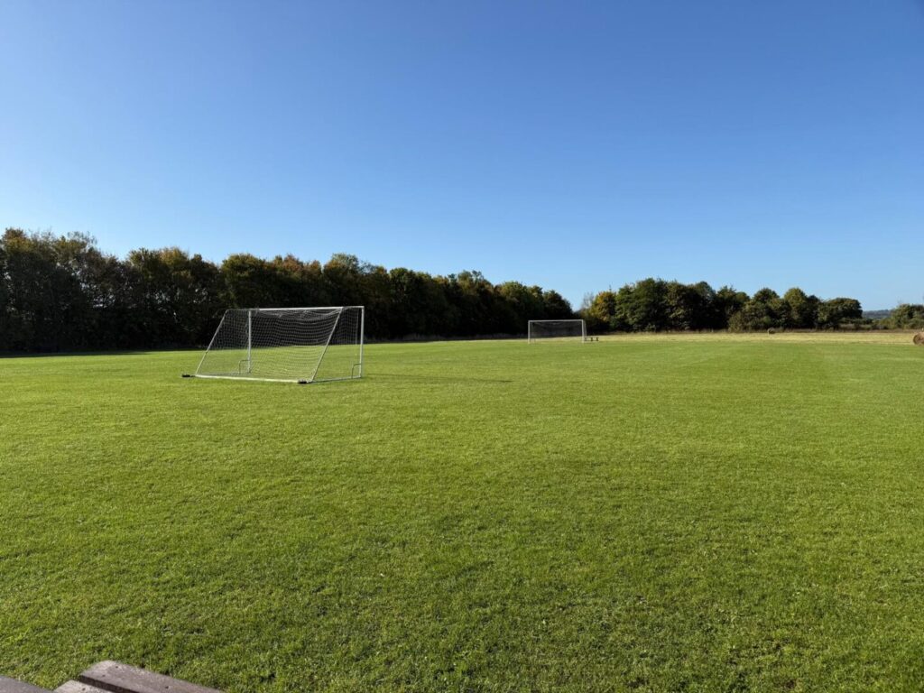 grass cutting on football pitch