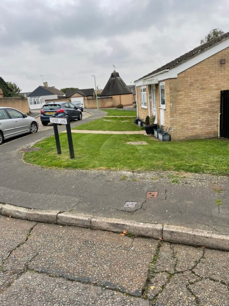 front garden contracted grass mowing service completed