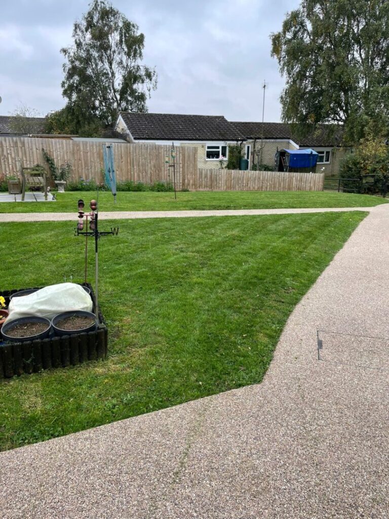 grass mowing next to path