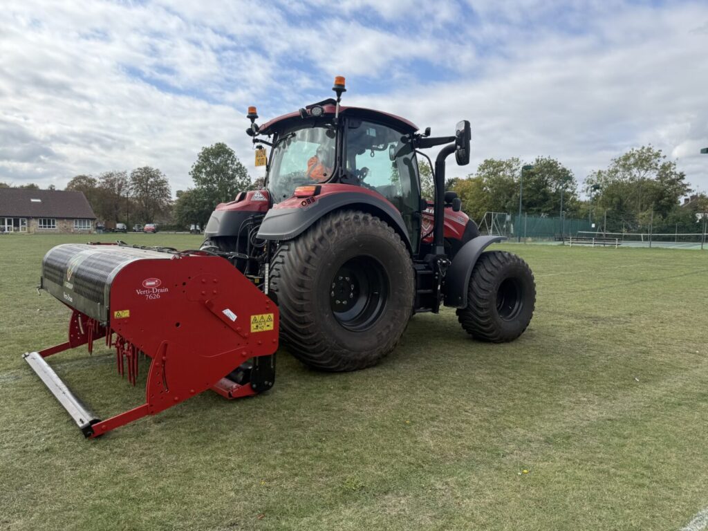 side view of tractor with verti drain equipment