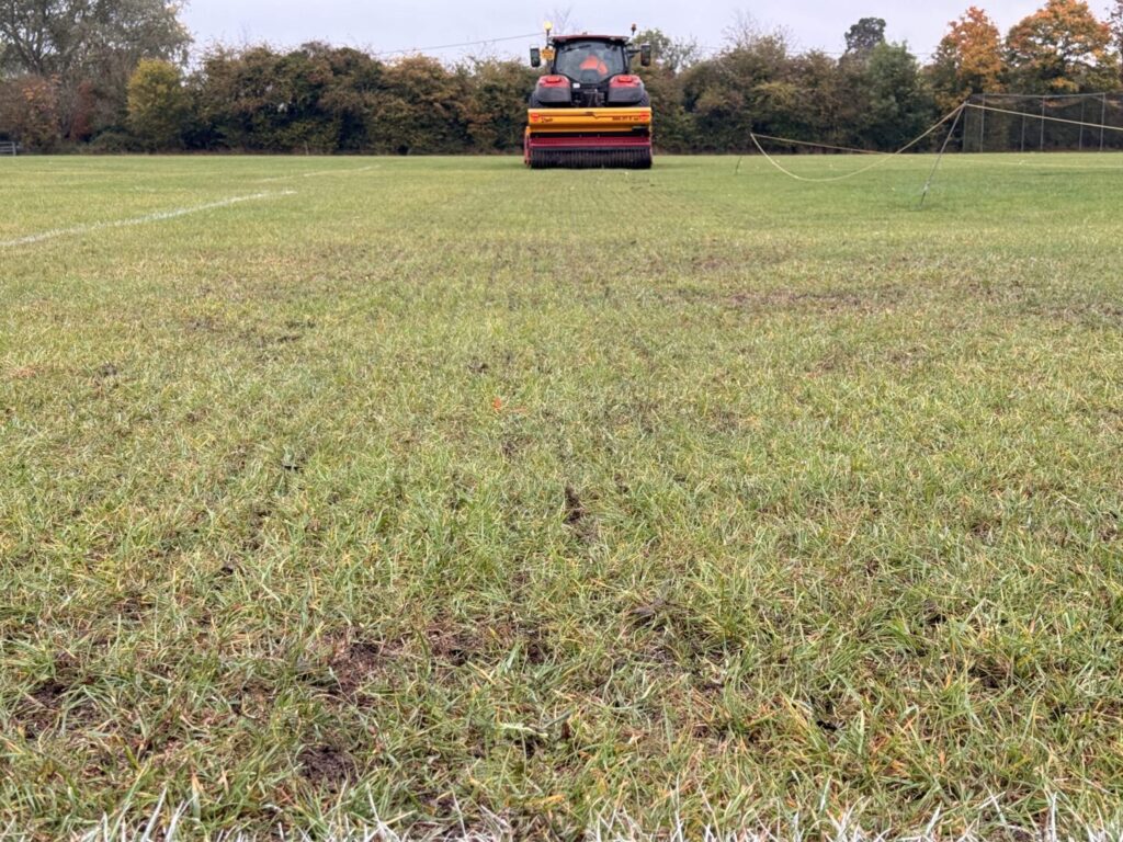 tractor top dressing and overseeding in east anglia