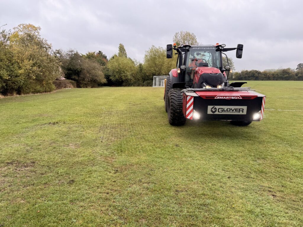 top dressing & overseeding service on large field with football goals