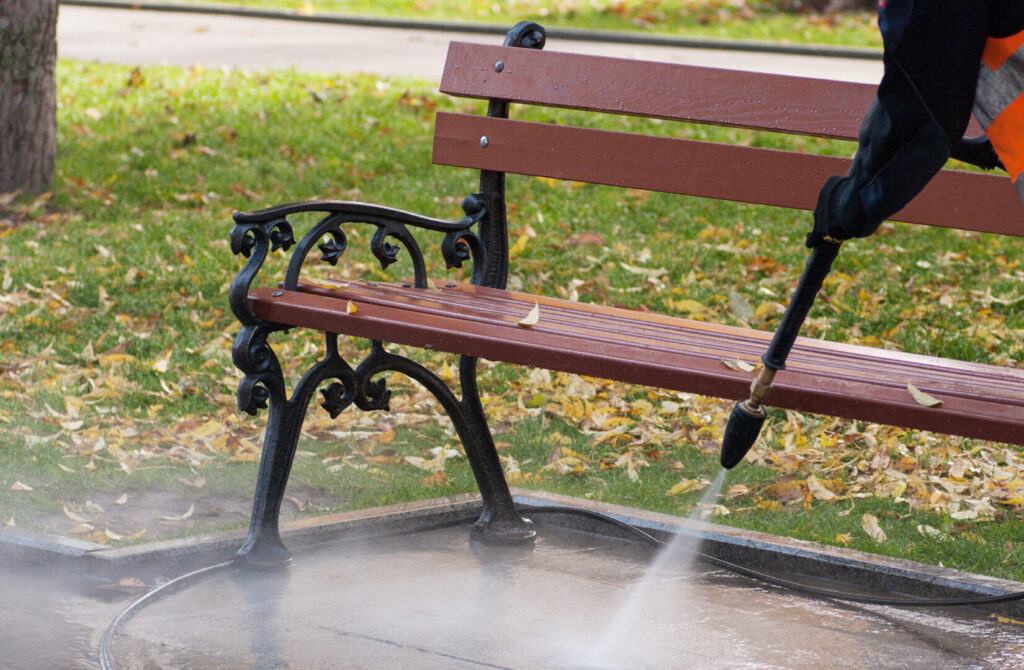 jet washing under park bench