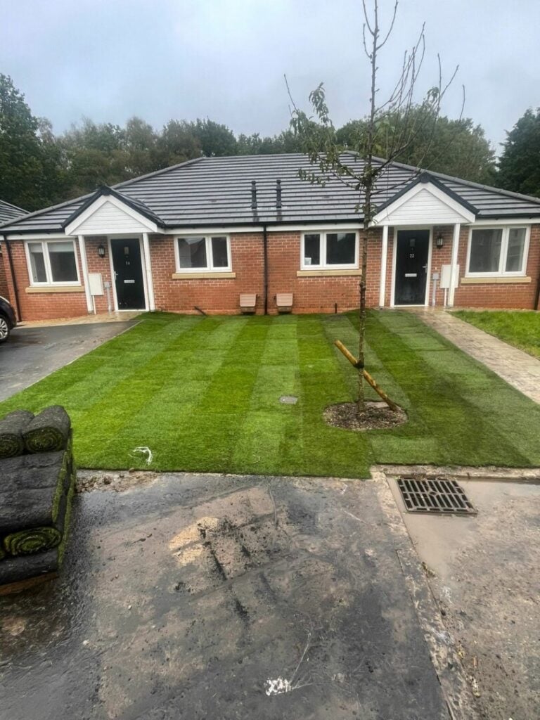 turf laying completed outside front of house