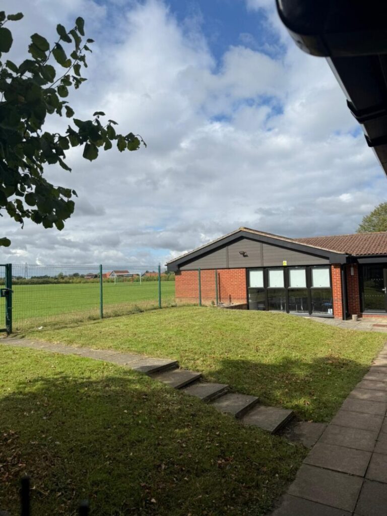 grass mowed outside brick building