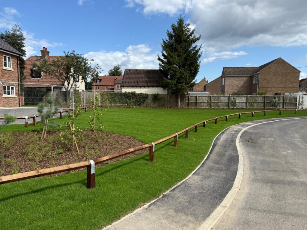 large area ground seeding and turf planted on new build area